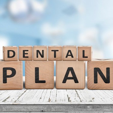 Blocks spell “dental plan”