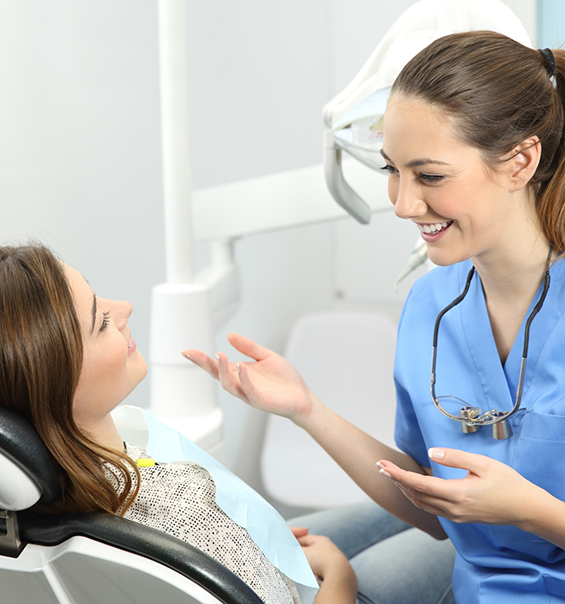 Dental hygienist talking to a patient