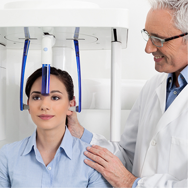 Dental patient getting a scan of her mouth and jaw taken by dentist