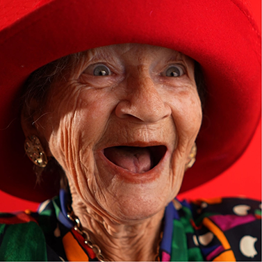 Senior woman grinning with no natural teeth left