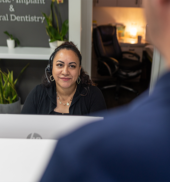 West Palm Beach dental team member talking to a patient