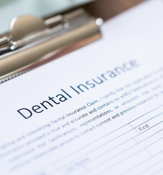 Dental insurance form on a clipboard