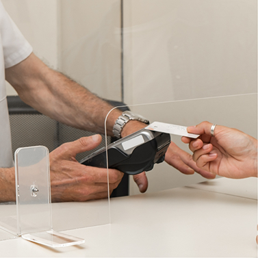 Person swiping their payment card in dental office