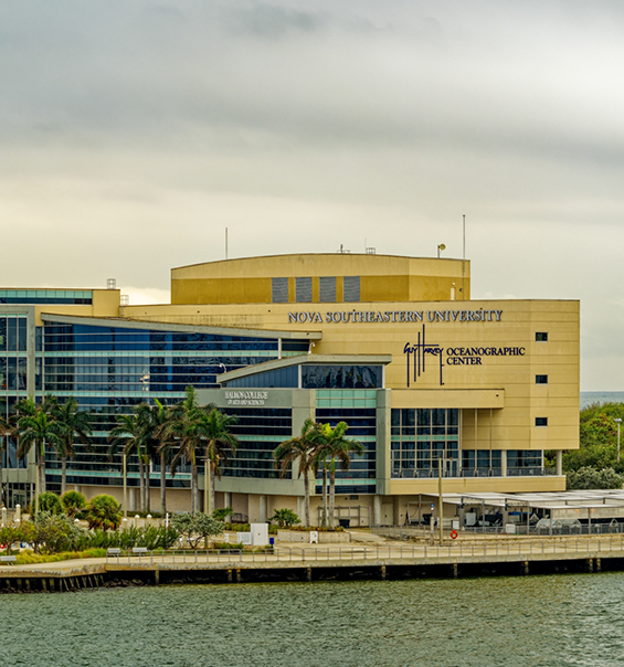 Large building near a body of water that says Nova Southeastern University Oceanographic Center