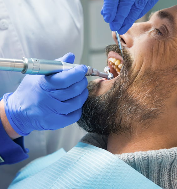 Man receiving a preventive dentistry checkup in West Palm Beach