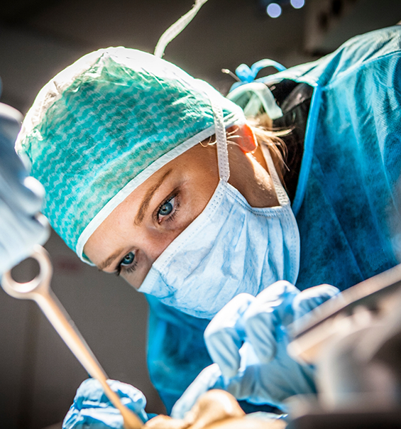 Close up of a dentists face while treating a patient