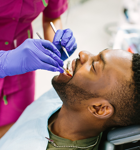 Man receiving a dental exam