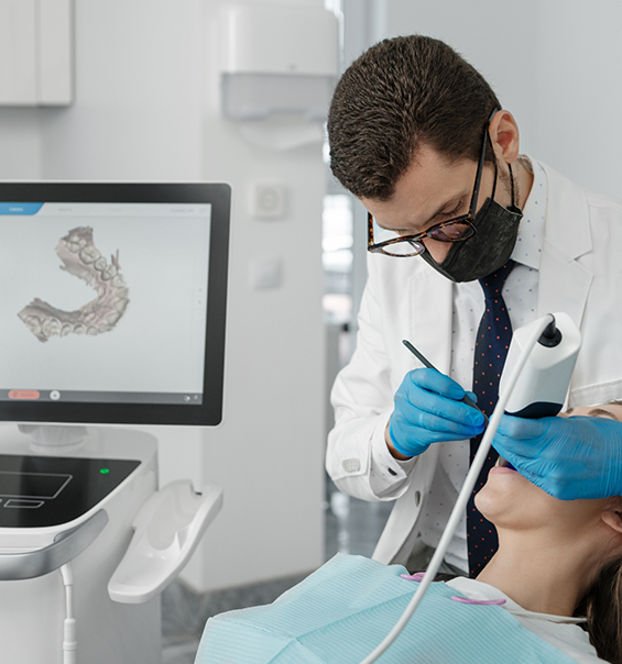 Dentist capturing digital dental impressions of a patients teeth