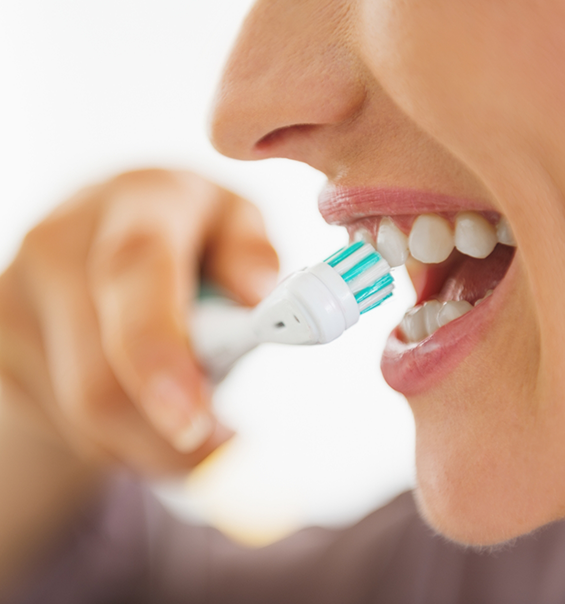 Close up of person brushing their teeth