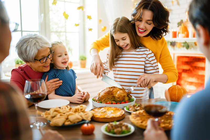 People enjoying a Thanksgiving dinner with good oral health