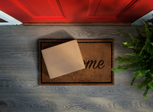 Packaged mail-in clear aligners sitting on welcome mat